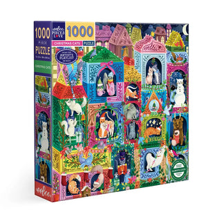 The Christmas Cats | 1,000 Piece Jigsaw Puzzle by eeBoo features Lydia Graves’s illustration of festive cats in vibrant, holiday-themed windows.