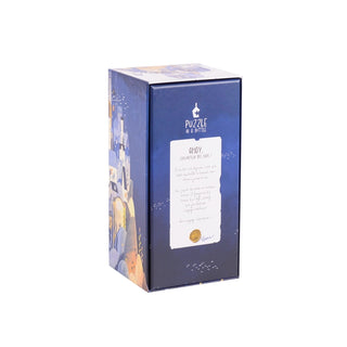 A rectangular blue box labeled "Puzzle in A Bottle Box Set | 12x 99 Piece Jigsaw Puzzles" by Trevell stands upright against a white background.