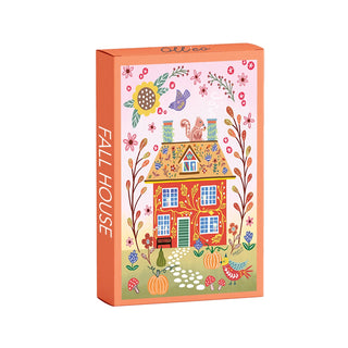 Olleo Puzzles’ Fall House | 99 Piece Jigsaw Puzzle comes in a rectangular box and showcases an illustrated house adorned with fall-themed decorations, including pumpkins, flowers, birds, and a squirrel on the roof—all rendered in a whimsical style inspired by Nordic folk art for a cozy autumn feel.