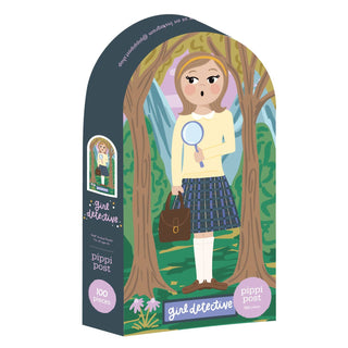 River Heights Girl Detective | 100 Piece Jigsaw Puzzle by Pippi Post features a girl sleuth in plaid with magnifying glass, between trees and mountains—ideal cozy mystery jigsaw or Nancy Drew-themed gift for young detective fans.