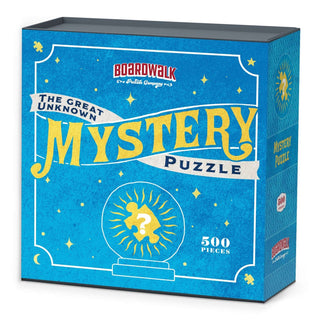A blue and yellow box from Boardwalk Puzzle Company, labeled Boardwalk Mystery Puzzle | 500 Piece Jigsaw Puzzle, displays a question mark inside a crystal ball and is part of the Boardwalk Mystery Puzzles series.