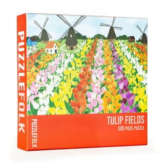 Puzzlefolk's Tulip Fields | 500 Piece Jigsaw Puzzle features an illustration of vibrant tulips, windmills, and houses beneath a blue sky on the box.