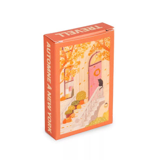 The Trevell Autumn in New York 99 Piece Jigsaw Puzzle comes in an eco-friendly rectangular orange box featuring a black cat on autumn-decorated stairs, inspired by New York’s fall charm.