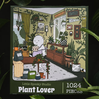 Little Spooky Studio’s Plant Lover | 1,024 Piece Jigsaw Puzzle features a white cartoon character caring for plants in a cozy, plant-filled room. Perfect for any plant enthusiast or puzzle fan!.