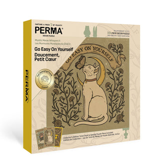 The PERMA Puzzle "Go Easy On Yourself" is a 321-piece jigsaw featuring a cat with a butterfly on its nose. The beige box includes foil embellishments, gold accents, and puzzle details for an elegant touch.