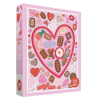 Surprise someone special with the Pippi Post Valentine’s Chocolate & Candy 500 Piece Jigsaw Puzzle, featuring an illustrated heart brimming with assorted candies, chocolates, and sweets against a pink background—a delightful Valentine’s Day gift or a sweet challenge for anyone who loves charming chocolate puzzles.