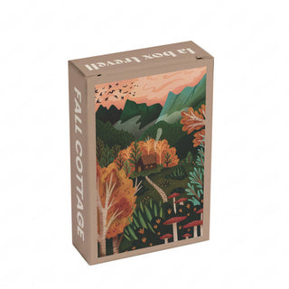 A 99-piece jigsaw puzzle from Trevell, titled Fall Cottage, featuring artwork of a cottage nestled in an autumn forest with mountains, flying birds, and mushrooms. Made in Turkey, this puzzle offers a charming finished size that is perfect for display.