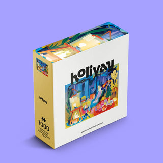 The Studio Apartment 1,000-piece jigsaw puzzle by Holiyay Puzzles features colorful indoor and outdoor scenes in whimsical floral designs, packaged in premium white and yellow matte-finish holiyay branding.