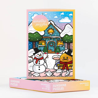 Celebrate the holidays with the Snowman | 1,000 Piece Jigsaw Puzzle by Sunshine Puzzles. This festive jigsaw features a charming cartoon scene of a snowy house, cheerful snowman, and smiling cookie character on the box. Made from recycled materials and measuring 48 x 68 cm, it promises hours of joyful holiday fun.
