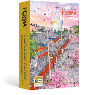 The PERMA Puzzle "Beijing | 500 Piece Jigsaw Puzzle" features an illustrated scene of the Miaoying Temple’s White Stupa, rooftops, pink blossoms, and birds. The box includes both English and Chinese text.