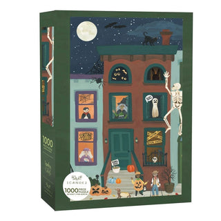 The 1canoe2 Spooky City | 1,000 Piece Jigsaw Puzzle features a haunted townhouse scene adorned with Halloween decorations, costumed figures, pumpkins, a skeleton, ghosts, a black cat, and a glowing full moon illuminating the night sky.