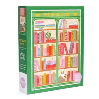 The Book Nook | 500 Piece Jigsaw Puzzle by Pippi Post features an illustrated bookshelf brimming with colorful books, lush plants, and a playful cat, all framed by a vibrant green border—making it the perfect gift for book lovers.