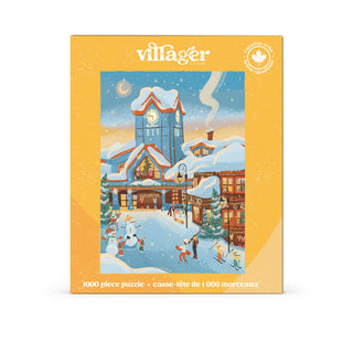Ski Resort by Villager Puzzles is a 1,000-piece jigsaw puzzle featuring a snowy village scene with people skating, buildings decorated with Christmas lights, and a prominent clock tower. This beautifully illustrated puzzle captures the charm of winter activities in a festive town.