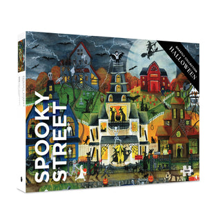 The Spooky Street | 1,000 Piece Jigsaw Puzzle by Pomegranate showcases a Halloween-themed scene filled with decorated houses, pumpkins, skeletons, bats, and a stormy sky. This festive puzzle promises hours of fun and makes an ideal activity for spooky season gatherings.