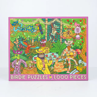 Bright and lively illustrated puzzle box featuring animal characters enjoying an outdoor scene, with “Party Down | 1,000 Piece Jigsaw Puzzle” by Birdie Puzzles written at the bottom—a delightful 1000 piece puzzle proudly made in the USA.