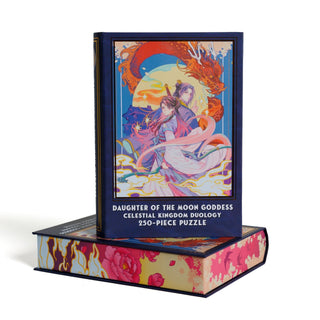 A Daughter of the Moon | 250 Piece Jigsaw Puzzle box featuring an illustration of two figures with a red dragon against a moon, resting atop a matching horizontal storage box.