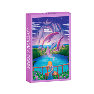 The Mystical Acores | 99 Piece Jigsaw Puzzle by Olleo Puzzles comes in a purple box with art of a woman by a lake, dolphins leaping in the night sky, and stars above—capturing the enchanting spirit of the Azores.