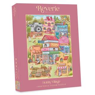 A Hobby Village | 1,000 Piece Jigsaw Puzzle box featuring a whimsical hobby village with a bookstore, art shop, and community garden.