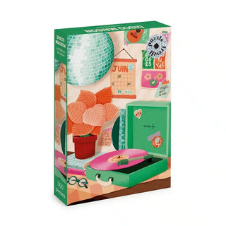 Disco Maison 500 Piece Jigsaw Puzzle box featuring an illustration of a disco ball, a potted plant, a portable record player, and a wall calendar in a retro design.