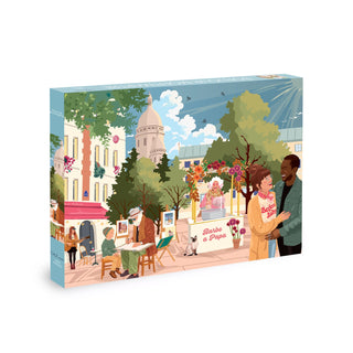 Experience the magic of Paris with the “Hello Montmartre” 1,000 Piece Jigsaw Puzzle by Olleo Puzzles, featuring a beautifully illustrated Paris street scene complete with artists, a strolling couple, a cotton candy stand, and charming buildings in the background—perfect for anyone who loves the enchanting atmosphere of Montmartre.
