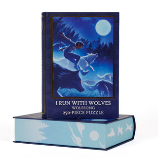 Two stacked I Run with Wolves | 250 Piece Jigsaw Puzzle boxes; the top box features an illustration of a person running with wolves under a full moon, with the text I Run With Wolves at the bottom.