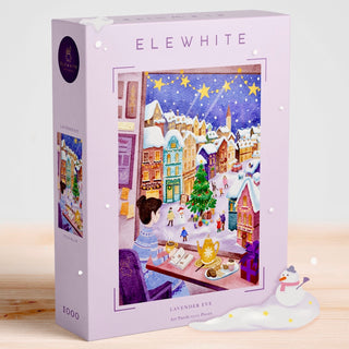 The Lavender Eve 1,000 Piece Jigsaw Puzzle by Elewhite features original art of a snowy town with a woman at her desk, festive decor, and a snowman—an ideal premium puzzle for fans of cozy winter scenes.