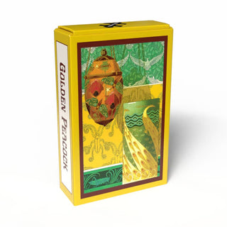 The Golden Peacock | 99 Piece Jigsaw Puzzle by Penny Puzzle comes in a yellow box adorned with an ornate design, showcasing a teapot, a patterned jug inspired by Art Nouveau vases, and green foliage on the front—an ideal choice for fans of vintage mini puzzles and the elegant style of Maurice Pillard Verneuil.
