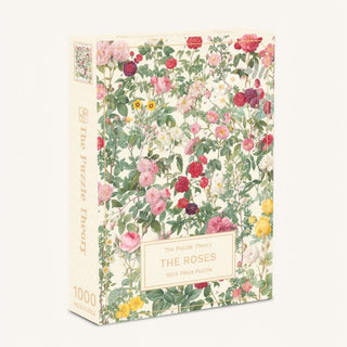 The Roses | 1,000 Piece Jigsaw Puzzle rectangular box featuring a Pierre-Joseph Redouté botanical illustration of roses on a cream background.