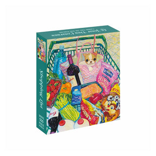 A Shopping List | 500 Piece Jigsaw Puzzle box featuring an illustrated shopping cart filled with a dog, wine, salmon, produce, and packaged groceries.