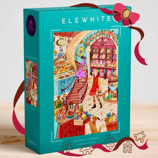 The Elewhite "Bonjour, Candies!" 1,000 piece jigsaw puzzle features a festive illustrated candy shop scene with people inside, decorative ribbons, and puzzle piece graphics on the premium box.