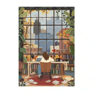 A person sits at a desk facing a city skyline, surrounded by books, plants, and the Trevell Falling Leaves 500 Piece Jigsaw Puzzle scattered among papers on the floor.