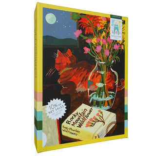 Enjoy piecing together the Bridgetown Puzzles Rocky Mountain Wildflowers 1,000 Piece Jigsaw Puzzle, featuring Allie Yacina’s charming illustration of a floral bouquet in a vase, a cat companion, and the book “Rocky Mountain Wildflower.” Crafted with a soft-touch finish for an enjoyable puzzling experience, 10% of net sales from each box are donated to a cause.