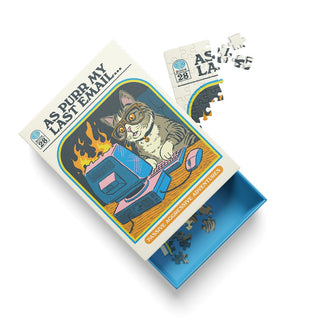The As Purr My Last Email | 99 Piece Jigsaw Puzzle from Ohh Deer displays Steven Rhodes’ signature humor, with a cartoon cat at a burning desk embodying office culture, and includes both assembled pieces and loose puzzle pieces in a blue tray.