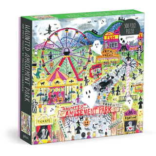 The Galison Michael Storrings Haunted Amusement Park 500 Piece Jigsaw Puzzle features a vibrant, illustrated scene by artist Michael Storrings, filled with ghosts, thrilling rides, spooky decorations, and festive Halloween motifs—perfectly capturing the eerie charm and lively spirit of a haunted amusement park.