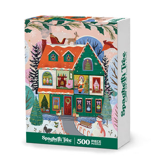 Home For the Holidays 500-piece jigsaw puzzle box featuring a festive, multi-story house decorated for the holidays, with Santa’s sleigh on the roof and a snowman in the yard.