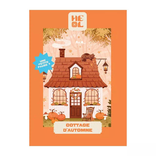 Illustration of a white cottage with a brown roof, autumn décor, pumpkins, and a cat on the roof with "Cottage d’Automne" text. Cottage D'Automne | 99 Piece Jigsaw Puzzle by Heol Editions—ideal for cozy scene lovers and puzzle fans.
