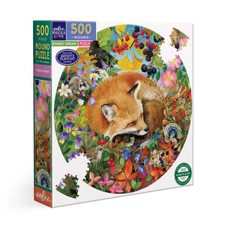 The Forest Dream 500 Piece Jigsaw Puzzle by eeBoo features a round illustration of a sleeping fox amid vibrant flowers, plants, and butterflies, and is made from sustainably sourced materials.