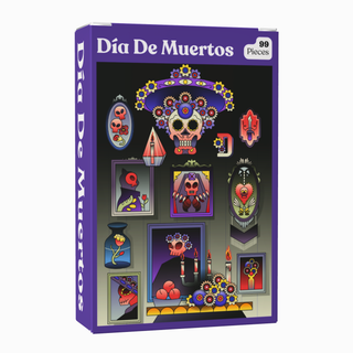 The Puzzledly Día De Muertos | 99 Piece Jigsaw Puzzle is a pocket-sized puzzle box showcasing Día de Muertos themed artwork with decorated skulls, candles, flowers, and framed portraits set against a black background.