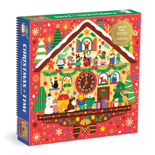 Front of the “Christmas Time | 500 Piece Jigsaw Puzzle” box by Galison, featuring a festive, cartoon-style cuckoo clock puzzle house decorated with animals, trees, snowmen, and Christmas decorations on a red background.