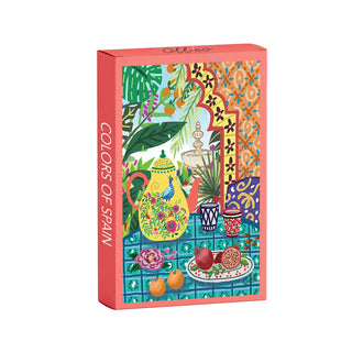 The Colors of Spain | 99 Piece Jigsaw Puzzle by Olleo Puzzles features vibrant art with a teapot, fruits, cup, and decorative tiles in floral and geometric patterns, capturing the lively Mediterranean spirit.