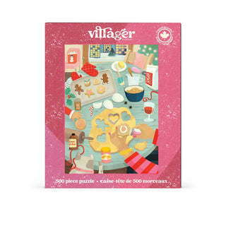 The Holiday Baking | 500 Piece Jigsaw Puzzle from Villager Puzzles showcases a charming illustrated baking scene filled with cookies, hot drinks, and baking tools on a pink background—making it the ideal holiday puzzle for cozy winter afternoons.