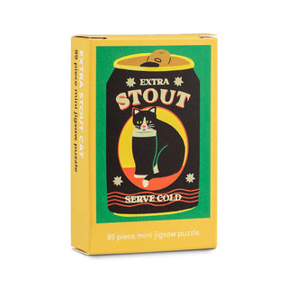 Bright yellow box featuring Naomi Wilkinson’s illustration of a black and white cat perched on a can labeled “Extra Stout Serve Cold.” Along the bottom, text reads: “99 Piece Mini Jigsaw Puzzle,” highlighting this Happily Jigsaw Puzzles’ Extra Stout Cat as the perfect mini puzzle for cat lovers.