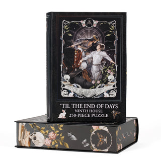 ’Til the End of Days 250 Piece Jigsaw Puzzle box, featuring a gothic illustration of a couple with skulls, flowers, and a moth on a book-shaped keepsake box.