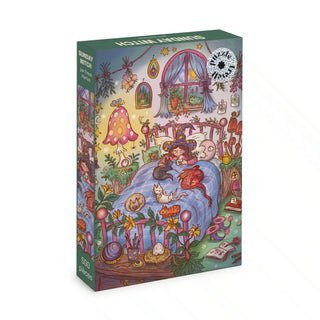 Discover magical coziness with the Sunday Witch | 500 Piece Jigsaw Puzzle by Trevell. Featuring vibrant artwork by Freya Hartas, this enchanting puzzle depicts a whimsical scene of a witch lounging on her bed with cats, surrounded by playful room decor, plants, and magical items—perfect for adding a touch of wonder to your puzzling experience.