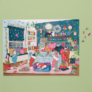 The Christmas Morning | 1,000 Piece Jigsaw Puzzle by WerkShoppe features a cozy bedroom with pets, stockings, gifts, and festive decor against a green wall; a few puzzle pieces are off to the side.