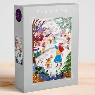 Experience the “Snowfall Symphony” 1,000-piece jigsaw puzzle by Elewhite, showcasing original artwork of a vibrant winter village bustling with people and snow-capped houses, beautifully crafted on premium puzzle board.