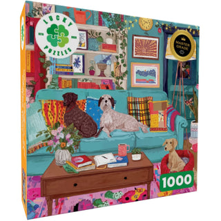 Illustrated puzzle box featuring a vibrant living room scene with three dogs, a patterned-cushion sofa, bookshelves, plants, and a coffee table. The box highlights 1,000 pieces and the brand Lucky Puzzles—Paws, Pillows, and Perfect: an inviting dog jigsaw puzzle ideal for dog lovers and cozy afternoons.
