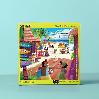 The Santo Domingo | 500 Piece Jigsaw Puzzle by StoPuzzle features an illustrated Caribbean beach scene with people, palm trees, shops, and activities. Finished puzzle measures 35 x 50 cm.