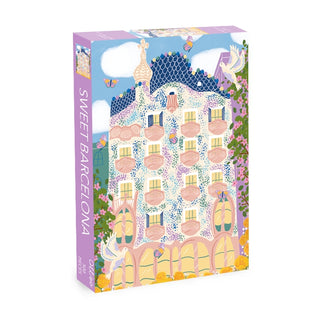 The Olleo Puzzles Sweet Barcelona 500 Piece Jigsaw Puzzle showcases a Gaudí-style building with balconies, flowers, and butterflies—a vibrant tribute to iconic Catalan architecture.