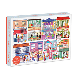 Discover the Let’s Eat | 1,000 Piece Jigsaw Puzzle by Happily Jigsaw Puzzles—a vibrant puzzle featuring colorful illustrations of beloved restaurants. Enjoy piecing together charming scenes such as fish and chips, pizza, tacos, ice cream, and a burger shop. This illustrated restaurants puzzle is perfect for food lovers and puzzle enthusiasts alike.